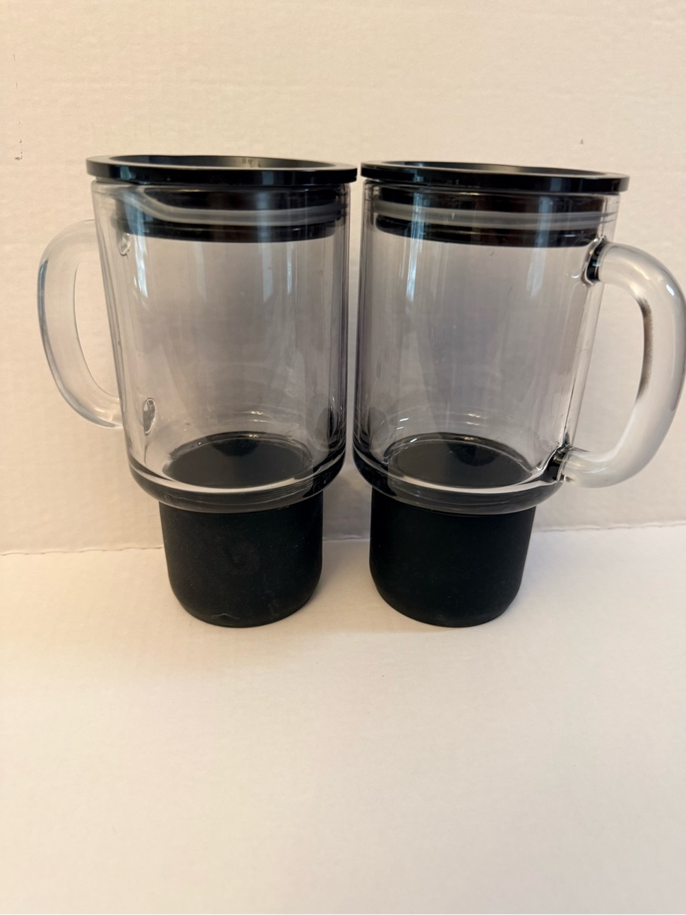 2 Glass tumblers with black silicone base